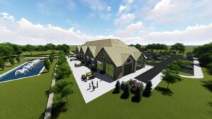 A Wide Aerial View Of A Commercial Building With A Fountain And Parking